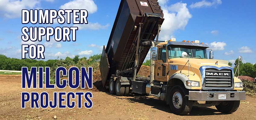 MDI roll-off truck unloading dumpster container at landfill