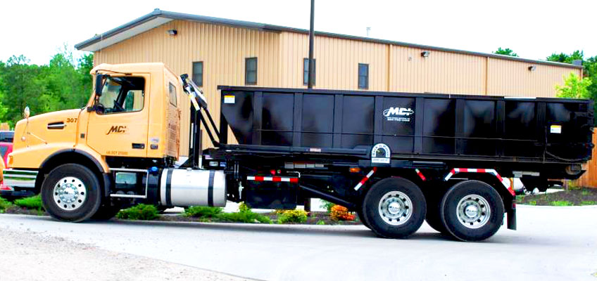 Affordable roll-off dumpster rentals in Albuquerque, New Mexico - MDI truck with roll-off dumpster.