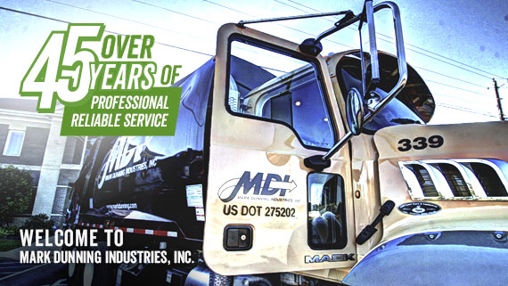 MDI rearload garbage truck in front of home office in Dothan, AL.